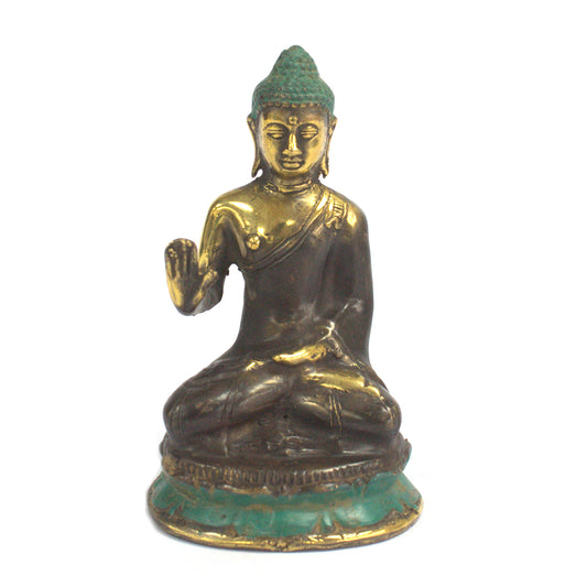 Buddha sitting with his hand up high